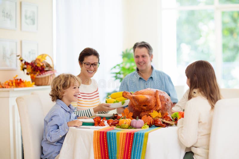 Family with Kids at Thanksgiving Dinner. Turkey Stock Image - Image of ...