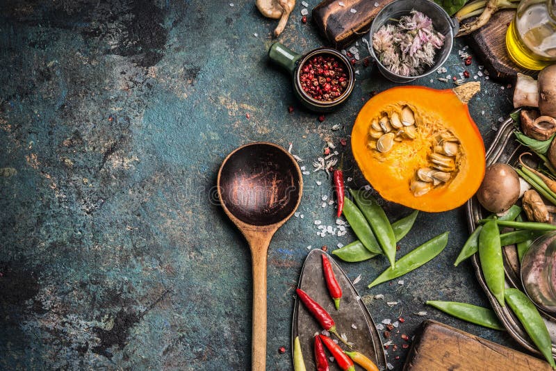 Thanksgiving seasonal cooking with Healthy and organic harvest vegetables and ingredients: pumpkin, Pea,chili,Mushrooms with woode royalty free stock photo Thanksgiving seasonal cooking with Healthy and organic harvest vegetables and ingredients: pumpkin, Pea,chili,Mushrooms with woode royalty free stock photo