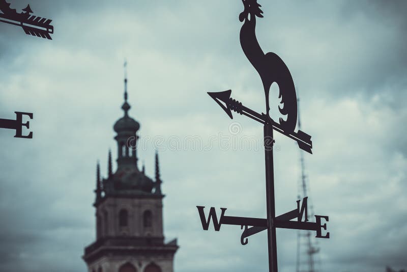 An old weathervane on a dark sky background. royalty free stock photo An old weathervane on a dark sky background. royalty free stock photo