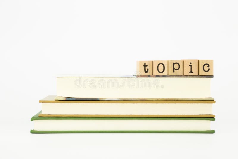 Themawort auf Holzstempeln und -büchern stockbild Themawort auf Holzstempeln und -büchern stockbild