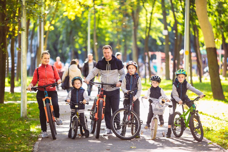 Theme family active sports outdoor recreation. A group of people is a big family of 6 people standing posing on mountain royalty free stock image Theme family active sports outdoor recreation. A group of people is a big family of 6 people standing posing on mountain royalty free stock image