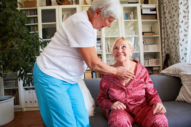 Therapist makes a trigger point massage on the sternum of a senior citizen with a ball. Therapist makes a trigger point massage on the sternum of a senior citizen with a ball