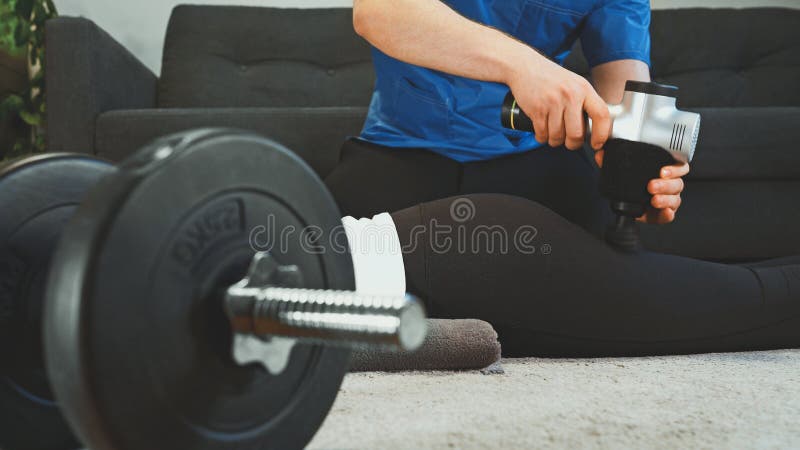 Therapist massaging woman`s legs