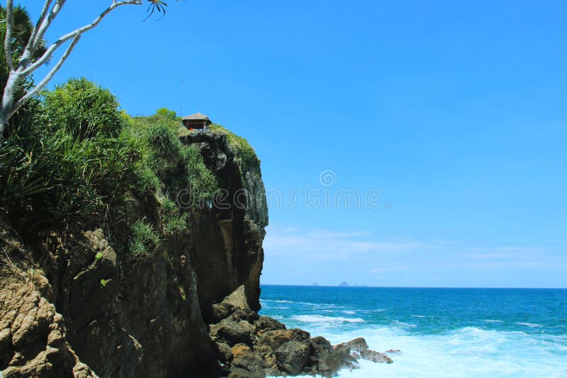 There are many beautiful beaches along the southern sea coast of Java Island, one of which is Papuma Beach in Jember, East Java, Indonesia. There are many beautiful beaches along the southern sea coast of Java Island, one of which is Papuma Beach in Jember, East Java, Indonesia