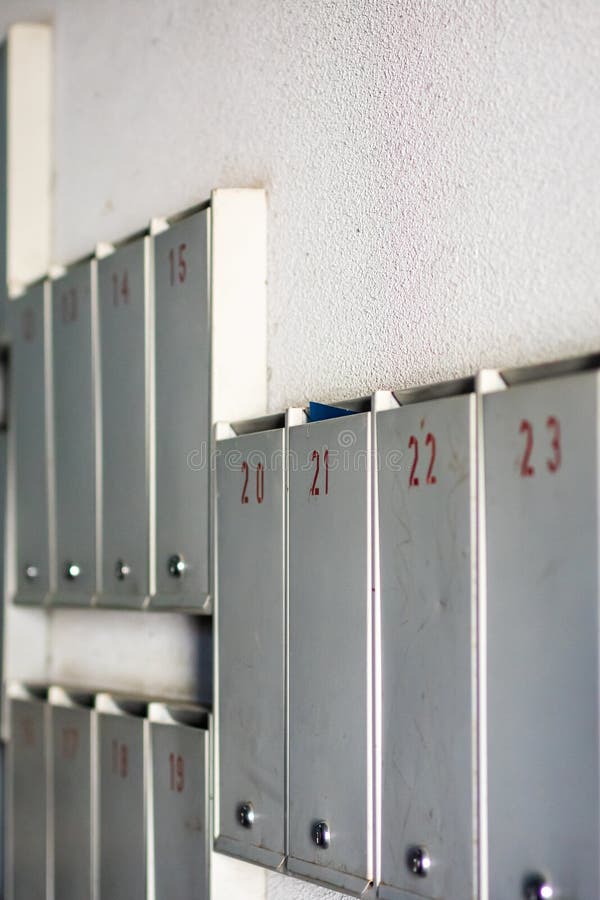 A neat row of metallic lockers proudly displaying the number 23 on each of them, reflecting the shine of silver and aluminium materials. Code division stock images, royalty-free photos and pictures