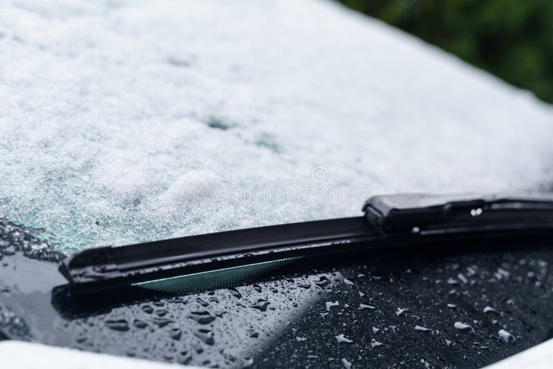 There is Snow on the Windshield of a Passenger Car Stock Photo Image