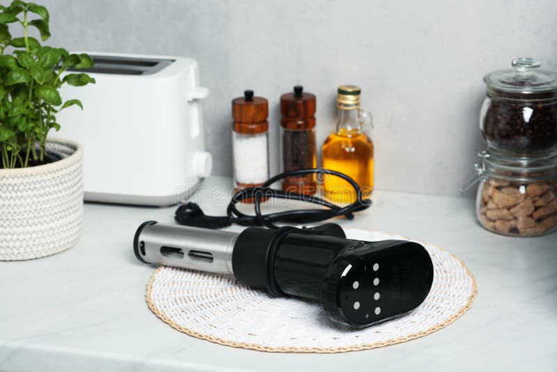 Thermal Immersion Circulator on Table in Kitchen. Sous Vide Cooking