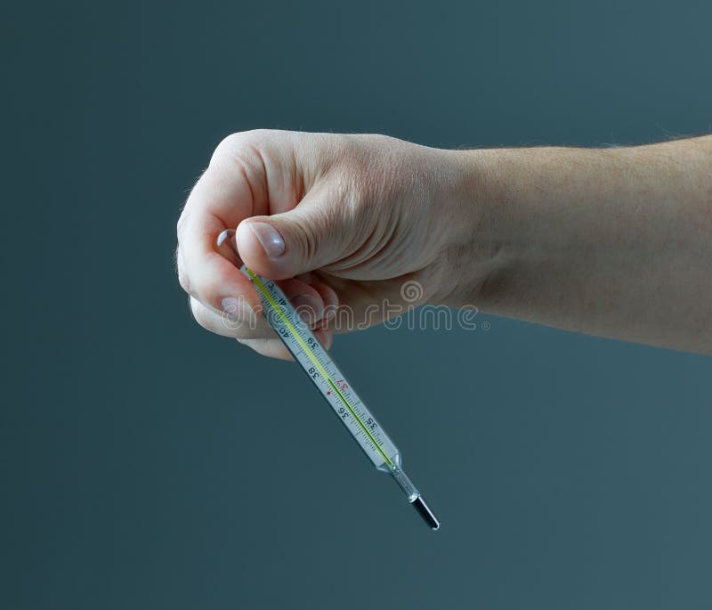 Thermometer in human hand stock photo. Image of diagnostic 177088914