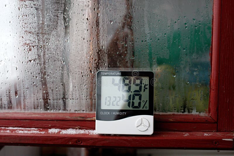 Thermometer and hygrometer of electronic to control temperature and humidity. Humidity indicator is indicated on the hygrometer of stock images