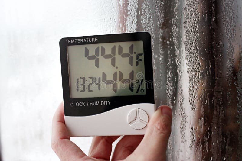 Thermometer and hygrometer of electronic to control temperature and humidity. Humidity indicator is indicated on the hygrometer of stock images