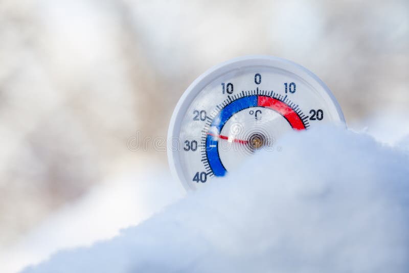 Thermometer with celsius scale placed in a fresh snow showing sub-zero temperature minus 25 degree - extreme cold winter weather concept. Thermometer with celsius scale placed in a fresh snow showing sub-zero temperature minus 25 degree - extreme cold winter weather concept