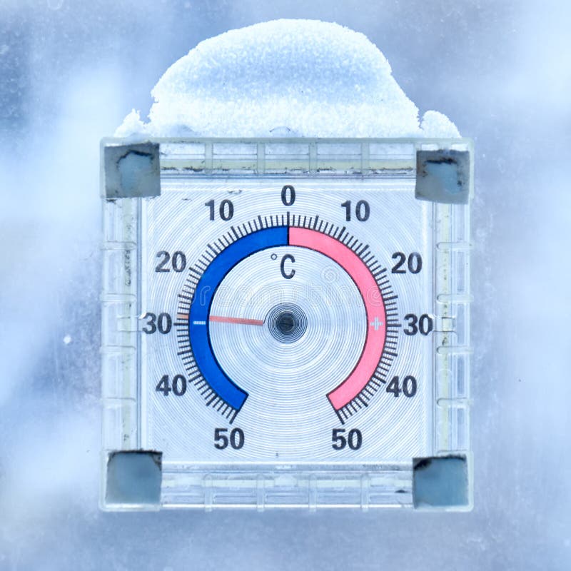 A Celsius thermometer on a window frame shows high temperatures of 35  degrees during an abnormal heat outside close-up., Stock image