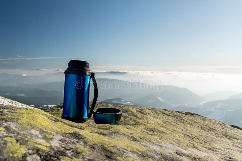 https://thumbs.dreamstime.com/b/thermos-drinks-background-mountains-stone-outdoors-mountain-landscape-201811451.jpg