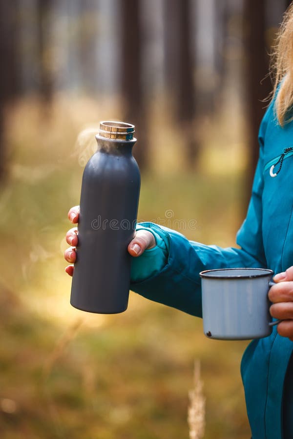 Thermos with Hot Drink. Refreshment during Hiking Stock Image