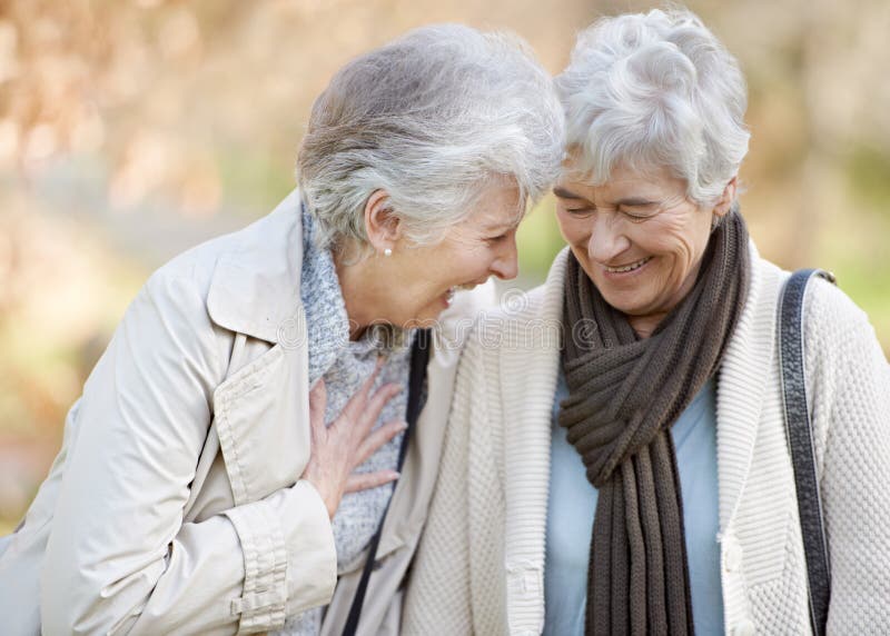 Theyre still best of friends. Cropped view of two senior woman smiling and chatting outdoors.