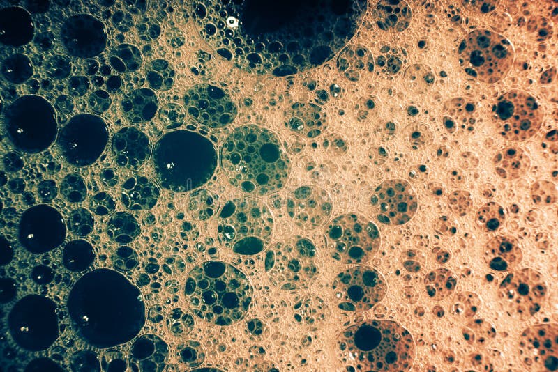 Thick Bubbling Soap Suds on the Surface of the Water. Trendy Colors