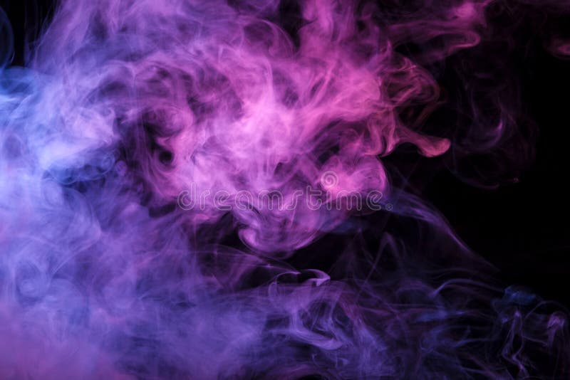 Thick colorful smoke of pink, purple blue on a black isolated background. Background from the smoke of vape