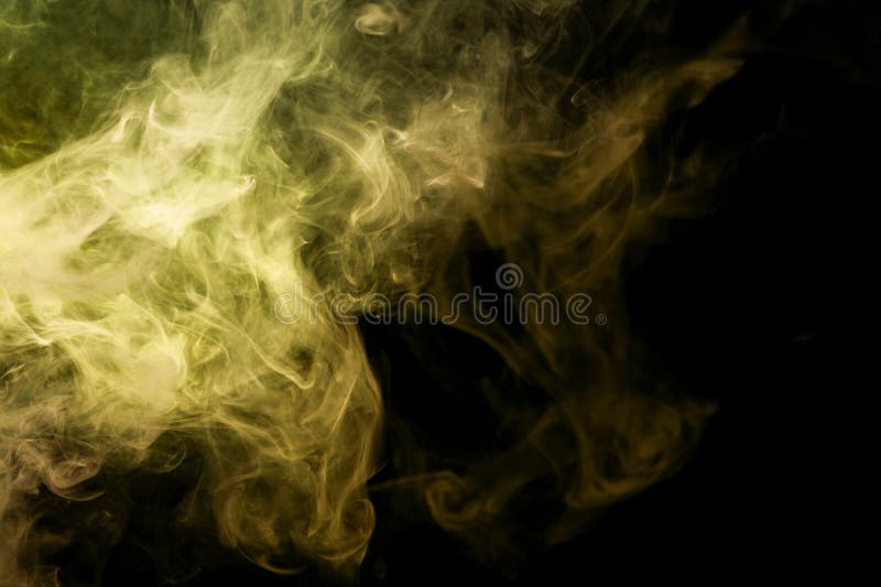 Thick yellow and orange smoke on a black background. Background from the smoke of vape