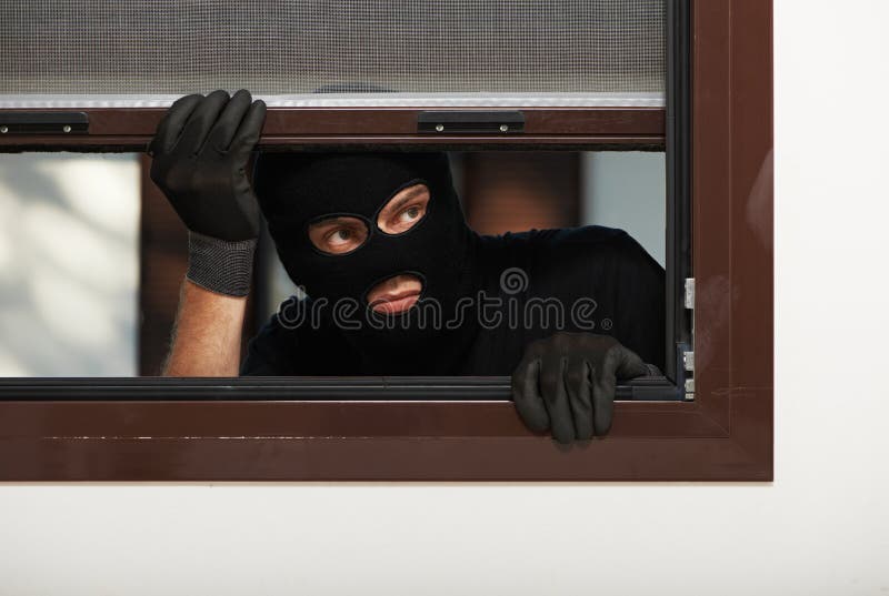 Thief burglar at house breaking