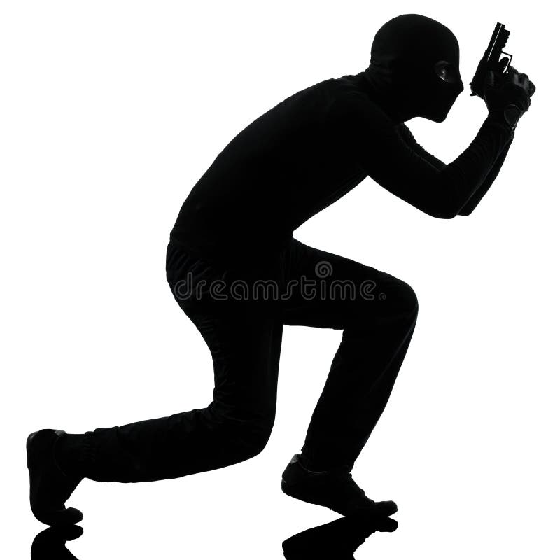 Thief criminal terrorist holding gun portrait