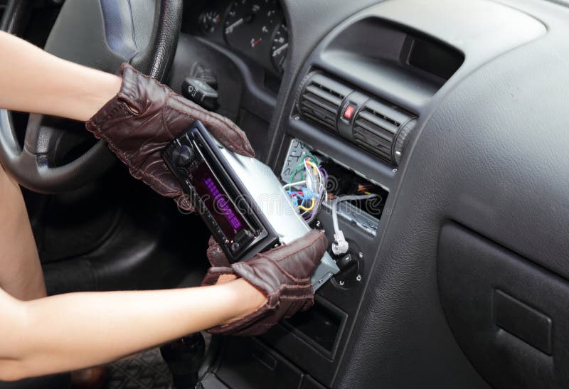 Thief stealing a car radio