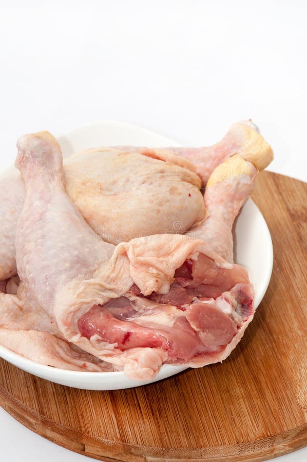Thighs and Drumsticks on a Plate and Wooden Board Stock Image Image