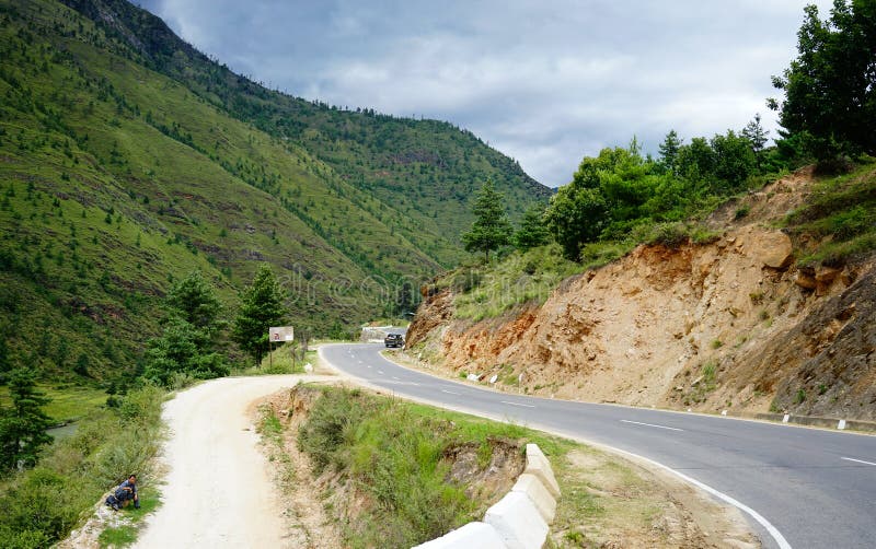 Mountain scenery in Thimphu, Bhutan. Thimphu, Bhutan - Aug 29, 2015. Mountain road at sunny day in Thimphu, Bhutan. Bhutan is located on the southern slopes of stock images Mountain scenery in Thimphu, Bhutan. Thimphu, Bhutan - Aug 29, 2015. Mountain road at sunny day in Thimphu, Bhutan. Bhutan is located on the southern slopes of stock images