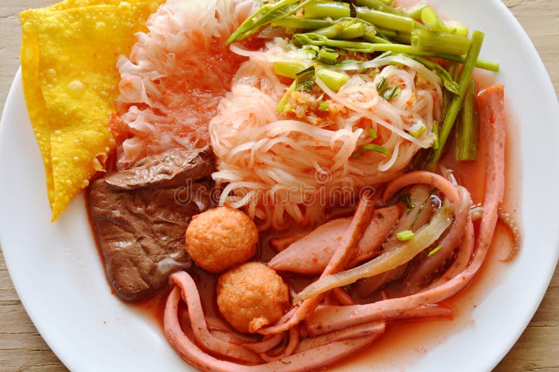 Thin Rice Noodle with Fish and Shrimp Ball Dressing Red Sauce on Plate