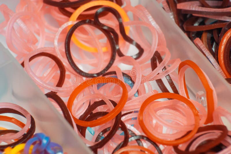 Thin Rubber Bands for Hair Orange and Pink Colors in a Plastic Box Stock  Photo - Image of object, hairstyle: 160526390
