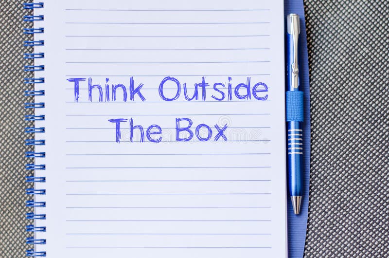Think outside the box write on notebook. Brainstorming, differently.