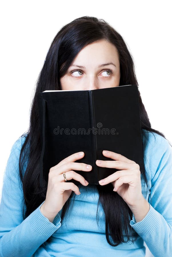 Thinking girl with a book