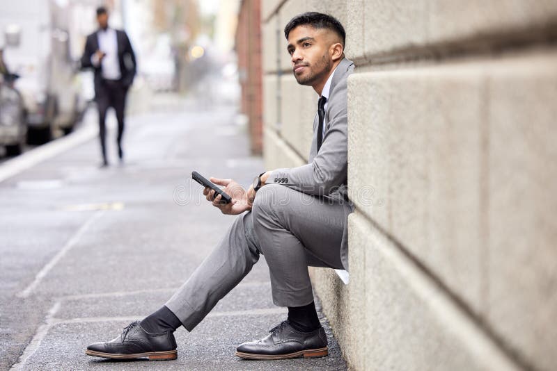 Thinking, Phone and a Businessman Sitting in the City for Social Media ...