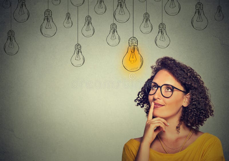 Thinking woman in glasses looking up with light idea bulb above head