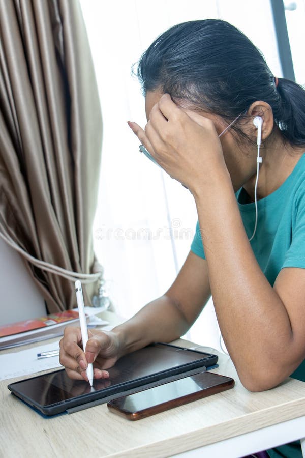 A thinking woman working with a tablet royalty free stock photography