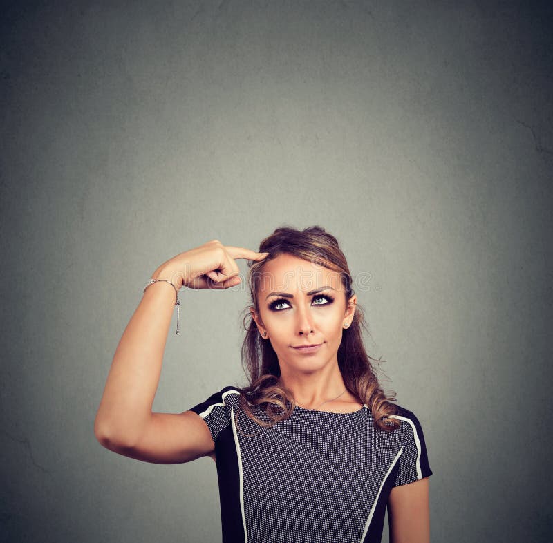 Thinking woman with question. Thoughtful girl scratching head looking up royalty free stock photos