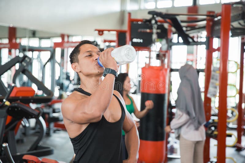 Thirsty healthy asian muscular man royalty free stock image Thirsty healthy asian muscular man royalty free stock image