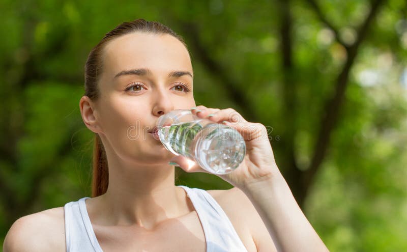 Thirsty woman drinking fresh water