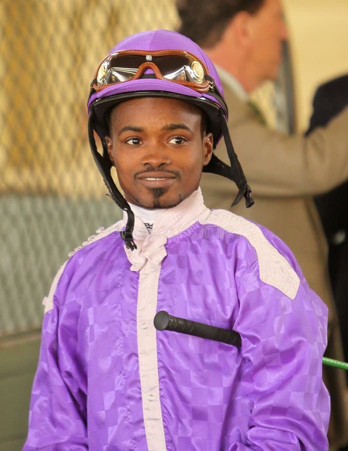 ARCADIA, CA - JAN 5: Jockey Kevin Krigger is all smiles after winning the Grade 1 Sham Stakes at Santa Anita Park on Jan 5, 2013 in Arcadia, CA. Here in the paddock, he waits for his next mount. ARCADIA, CA - JAN 5: Jockey Kevin Krigger is all smiles after winning the Grade 1 Sham Stakes at Santa Anita Park on Jan 5, 2013 in Arcadia, CA. Here in the paddock, he waits for his next mount.