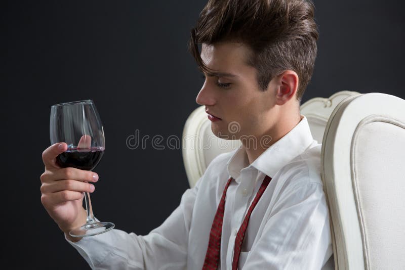 Thoughtful Androgynous Man Holding Wine Glass Stock Image Image of