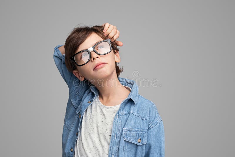 Thoughtful boy looking up