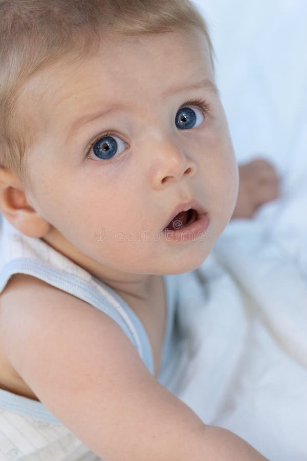 Thoughtful Calm Little Blue Eyed Baby Boy Stock Photo Image Of Gazing