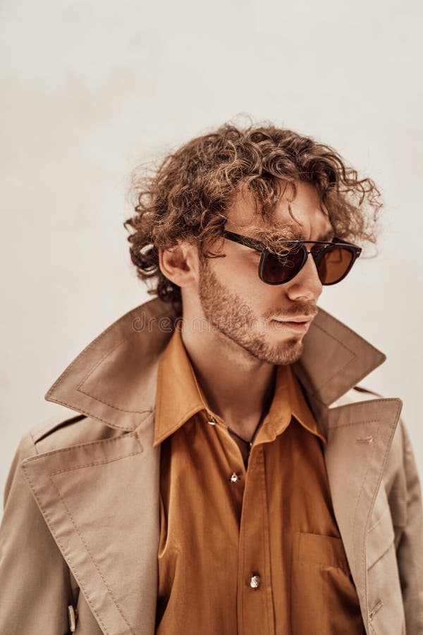 Thoughtful and Curly Man Wearing Sunglasses Posing in the Bright Studio Looking Rich Stock Photo - Image of interested, closeup: 181957996 Thoughtful and Curly Man Wearing Sunglasses Posing in the Bright Studio Looking Rich Stock Photo - Image of interested, closeup: 181957996