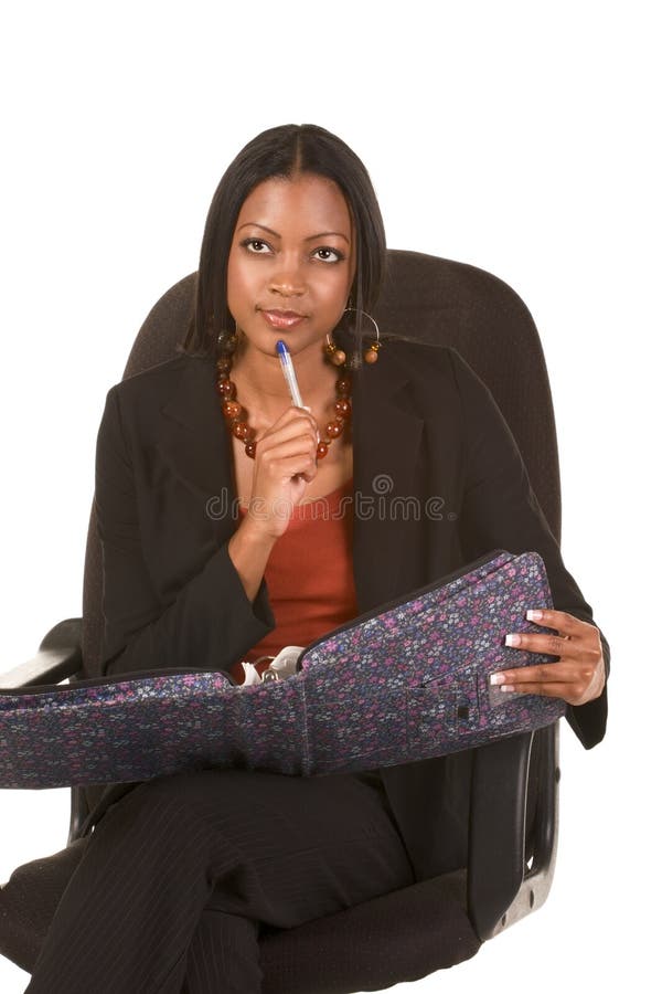 Thoughtful ethnic adult student with folder royalty free stock image