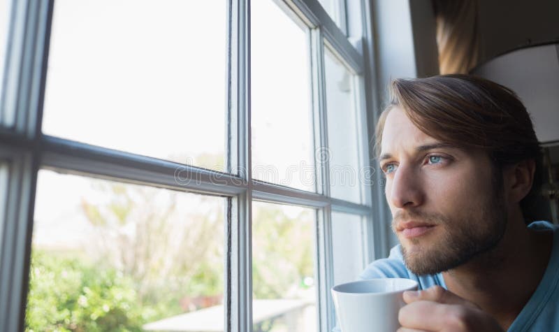 Young man at the window stock photo. Image of casual - 30207172