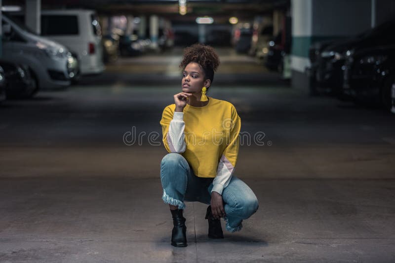 Thoughtful Millennial Black Woman in Trendy Outfit in Underground Parking  Stock Photo - Image of female, confident: 209578114