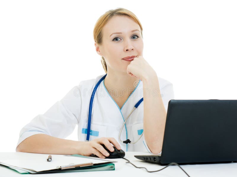 Thoughtful woman doctor looks into the camera