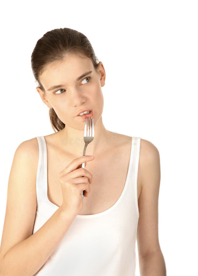 Pretty thoughtful woman with fork looking up. Pretty thoughtful woman with fork looking up