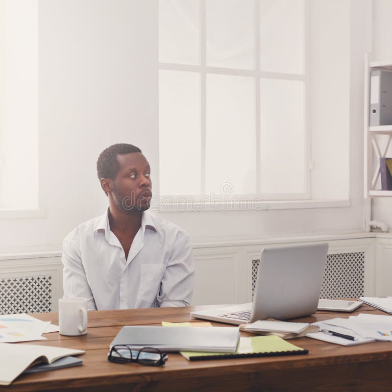 Thoughtful young black man enjoying his successful business stock images Thoughtful young black man enjoying his successful business stock images