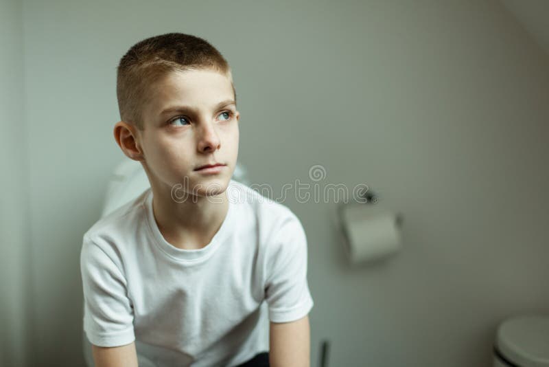 Thoughtful Boy Sitting Toilet Stock Photos - Download 11 