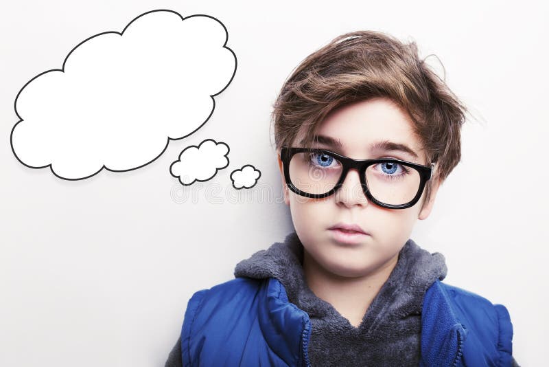 Thoughtful Young Boy Wearing Glasses with an Empty Thought Bubble Stock